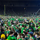 Notre Dame students celebrate on the field after the Irish’s OT win over Clemson.